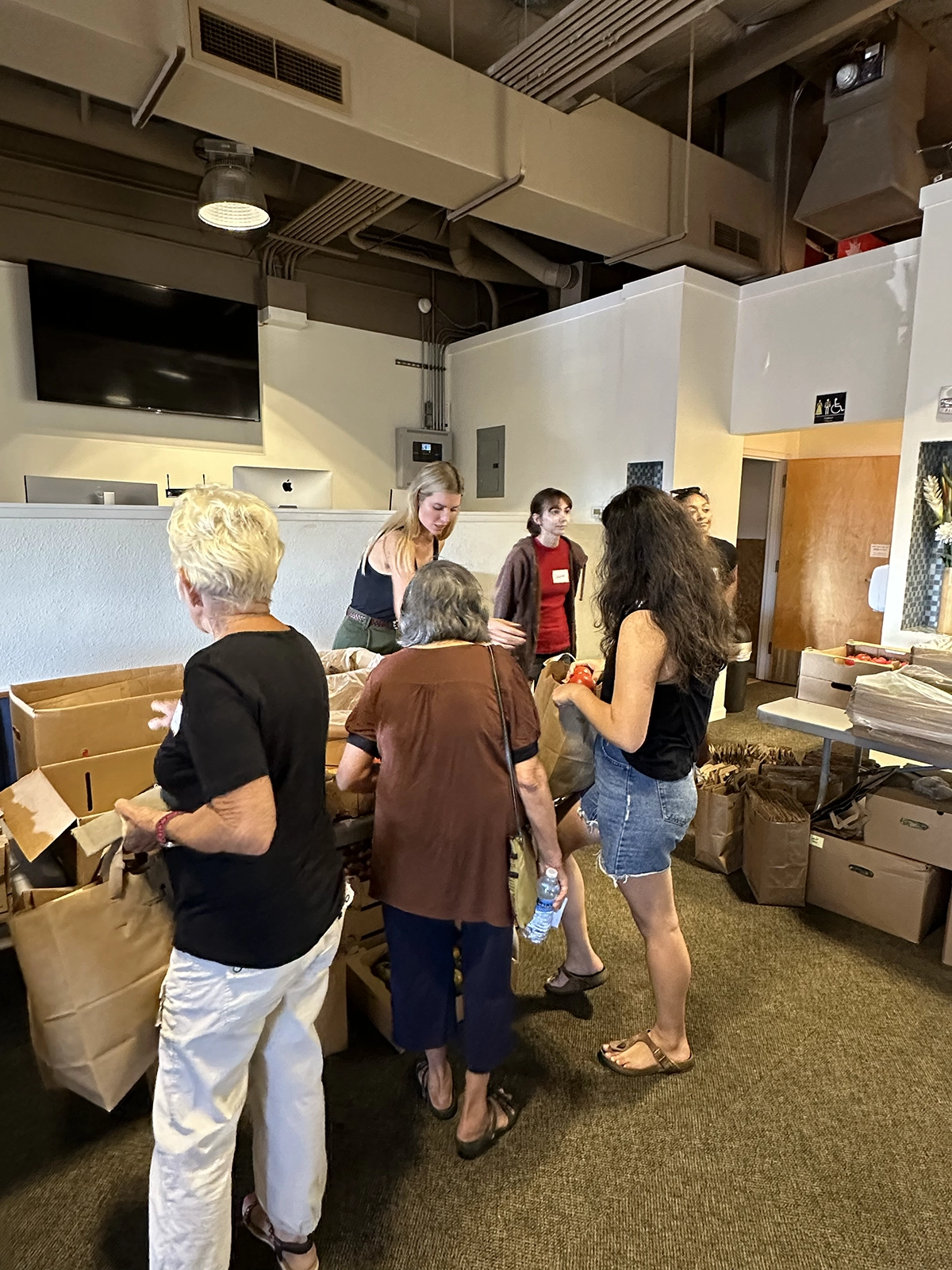 Ivanka Trump passing supplies.