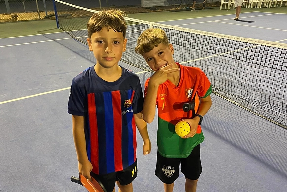 Two boys on a pickleball court during a CityServe Israel outreach event in Ein Habesor, supporting families impacted by ongoing conflict.