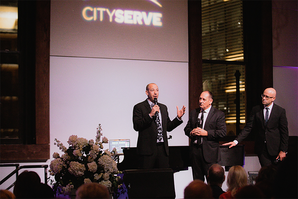 CityServe leaders speak on stage at the Nashville event supporting relief efforts in Israel and Ukraine.