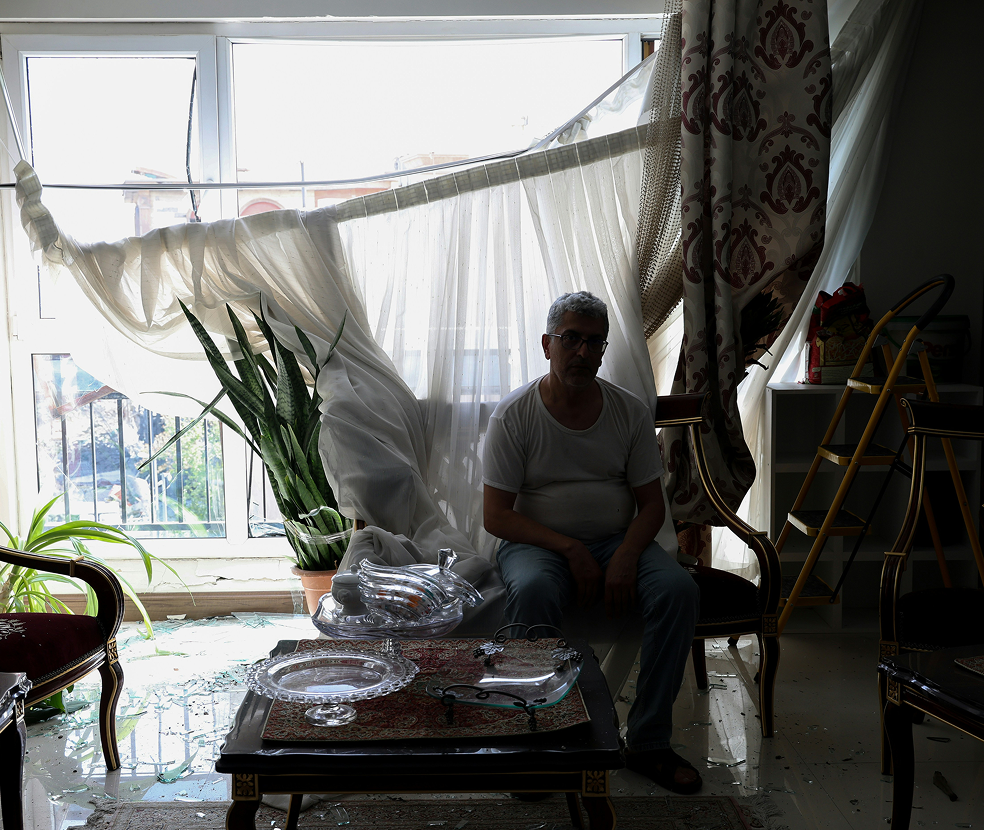 Family inside damaged home in Israel during humanitarian crisis.